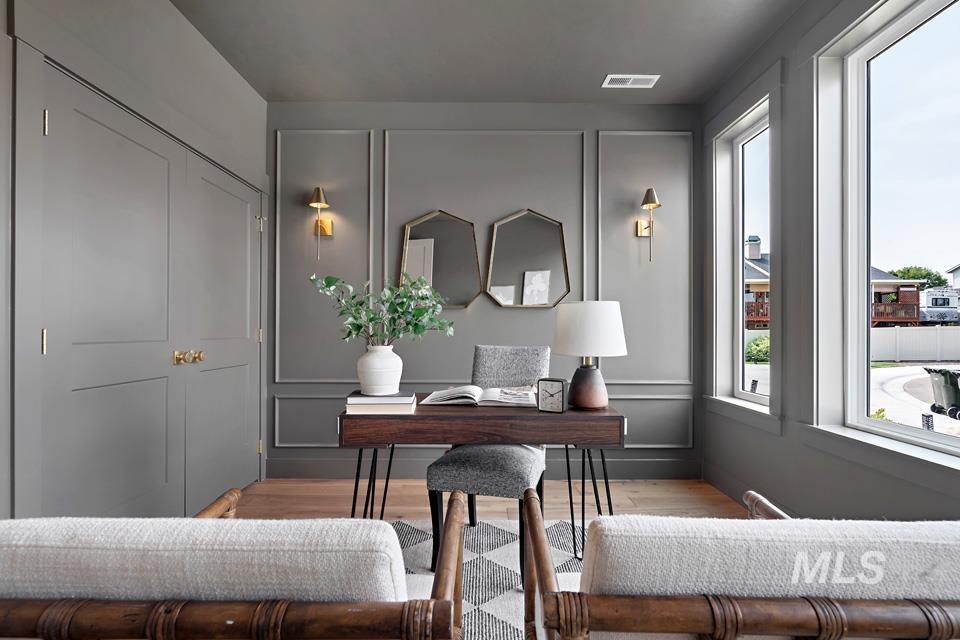 3322 South Volunteer Place Meridian, ID 83642 - Photo 41 of 50 Office space with a decorative wall and wood finished floors