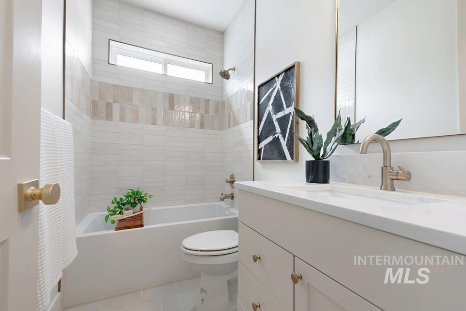3322 South Volunteer Place Meridian, ID 83642 - Photo 42 of 50 Bathroom with shower / tub combo with curtain, vanity, and light tile patterned floors