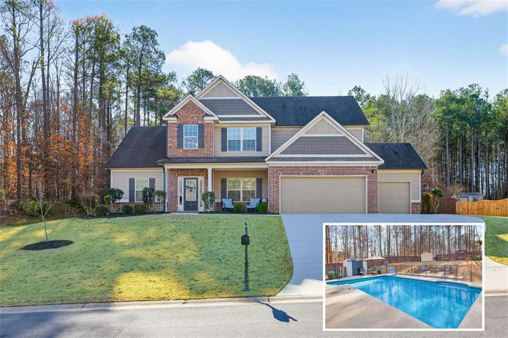65 Kimberly Way Hull, GA 30646 - Photo 1 of 1 a front view of a house with garden