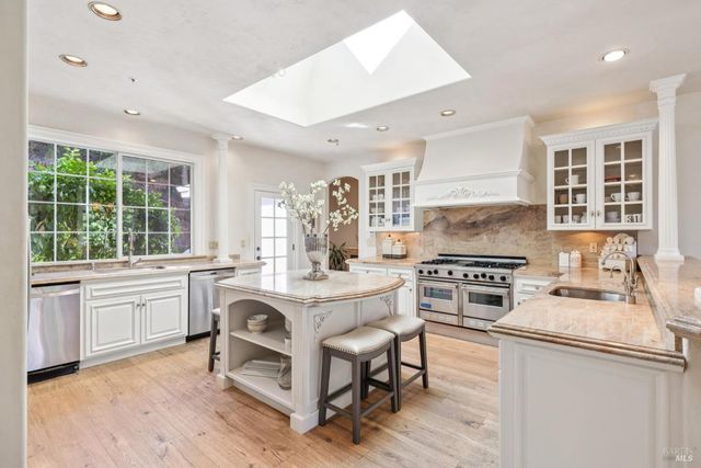 a bedroom with couch and a large window