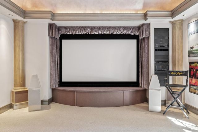 a view of a house with a yard and sitting area