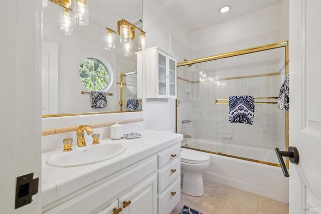 a view of a house with pool and sitting area