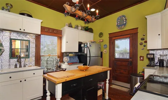 a kitchen with a table and chairs in it