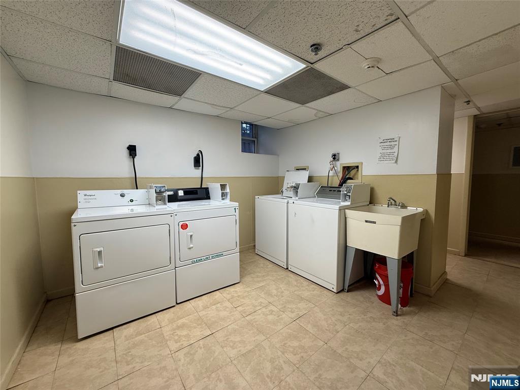 215 Orient Way, Unit C2 Rutherford, NJ 07070 - Photo 22 of 25 a utility room with dryer and washer