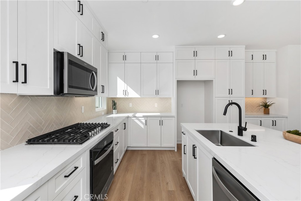 31645 Williams Rancho Mission Rancho Mission Viejo, CA 92694 - Photo 12 of 58 a kitchen with a sink a stove and cabinets