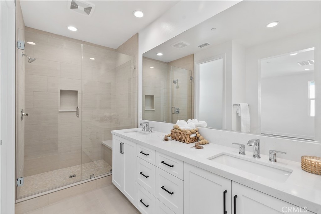 31645 Williams Rancho Mission Rancho Mission Viejo, CA 92694 - Photo 18 of 58 a bathroom with a granite countertop sink mirror and double