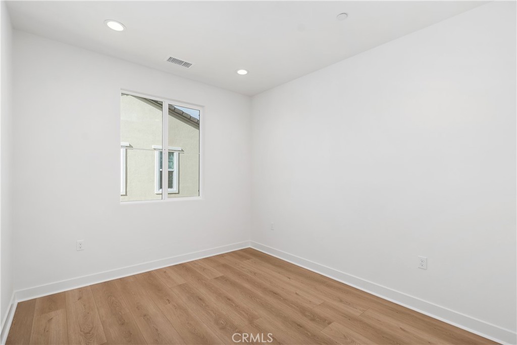31645 Williams Rancho Mission Rancho Mission Viejo, CA 92694 - Photo 20 of 58 an empty room with wooden floor and windows