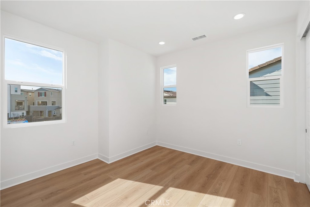 31645 Williams Rancho Mission Rancho Mission Viejo, CA 92694 - Photo 21 of 58 an empty room with wooden floor and window