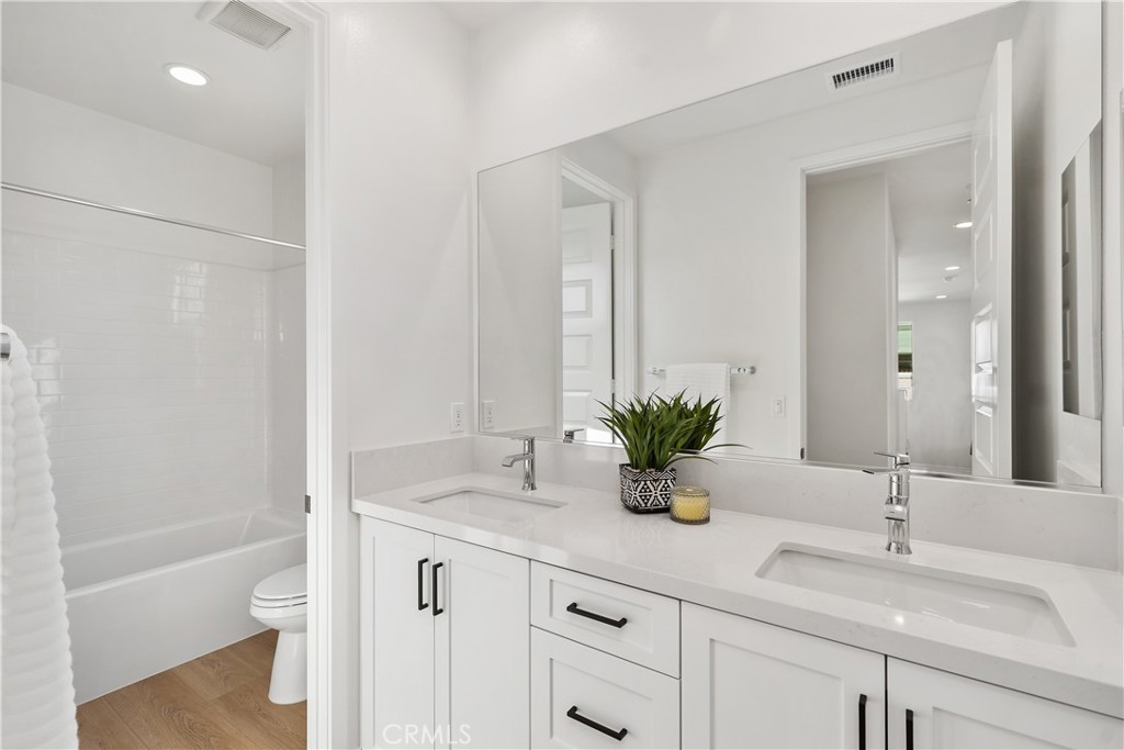 31645 Williams Rancho Mission Rancho Mission Viejo, CA 92694 - Photo 22 of 58 a bathroom with a sink a toilet and a large mirror