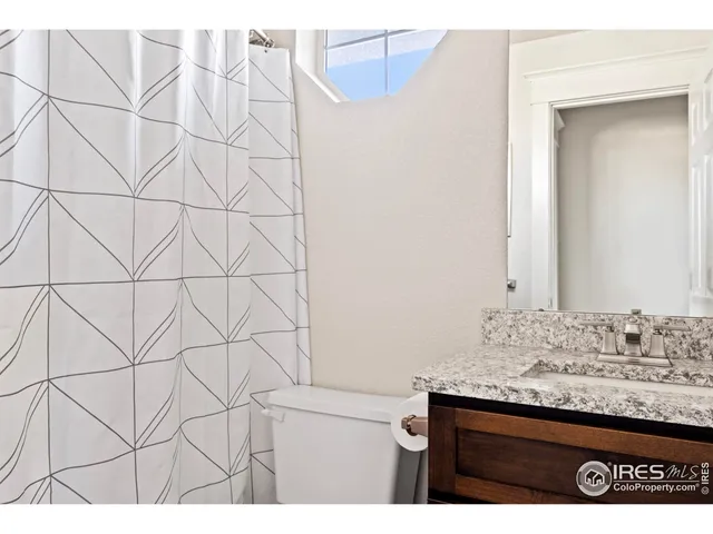 a room with gym equipment and a large window