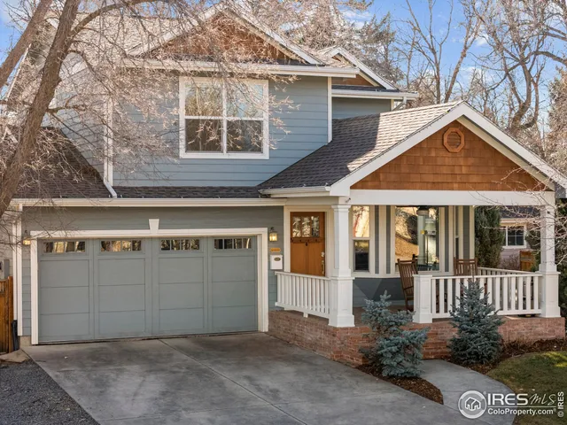 a front view of a house with a garage