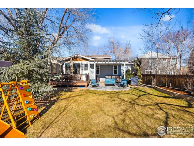 a backyard of a house with seating space