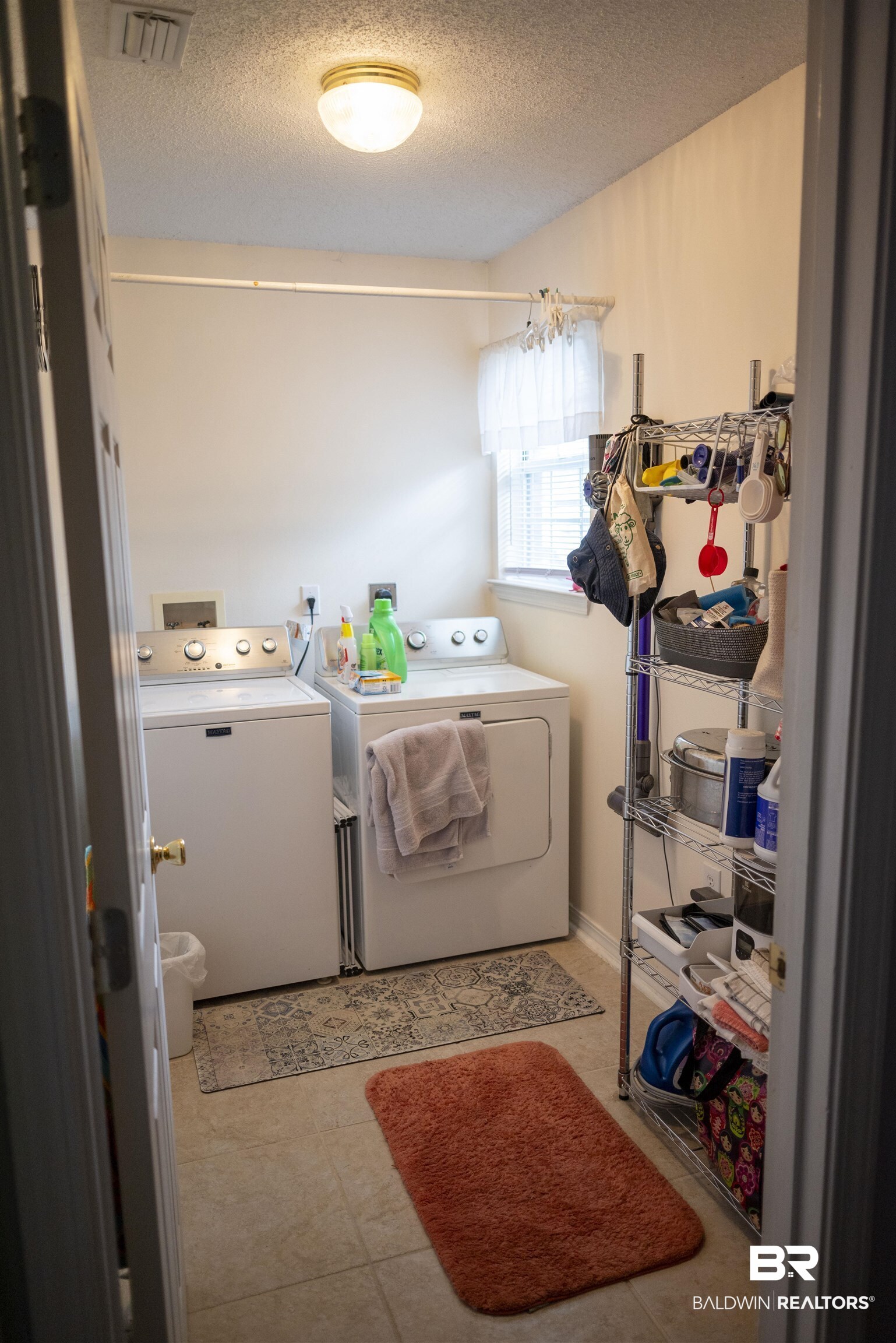 808 Wisteria Lane Foley, AL 36535 - Photo 17 of 19 Laundry area with a textured ceiling and washer and clothes dryer