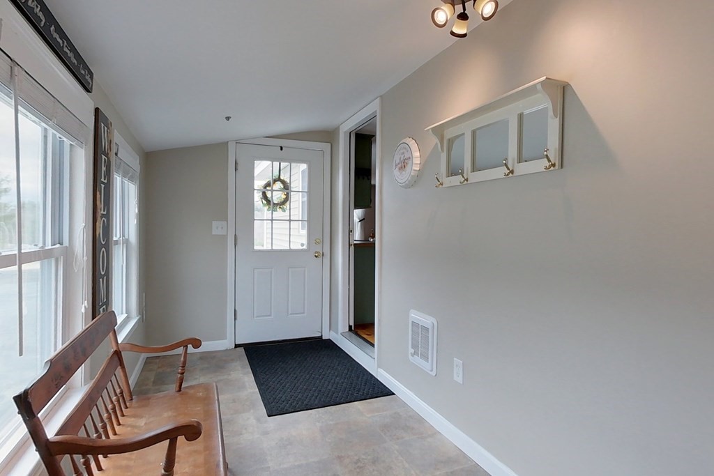 384 Richardson Road Ashby, MA 01431 - Photo 13 of 40 a view of a livingroom with furniture and windows