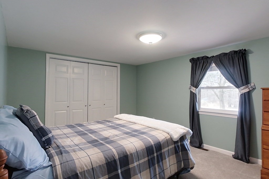 384 Richardson Road Ashby, MA 01431 - Photo 18 of 40 a bedroom with a bed and a window