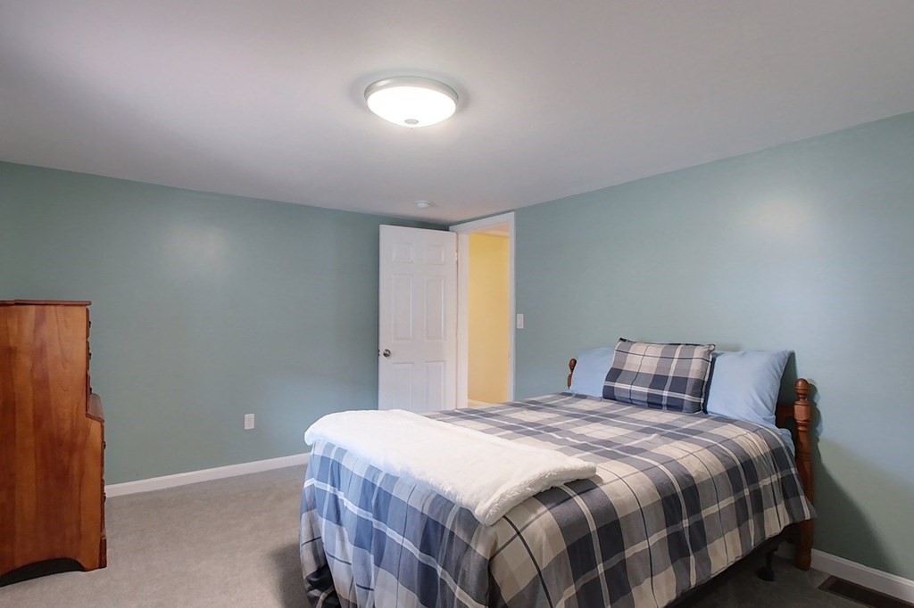 384 Richardson Road Ashby, MA 01431 - Photo 19 of 40 a bedroom with a bed and window
