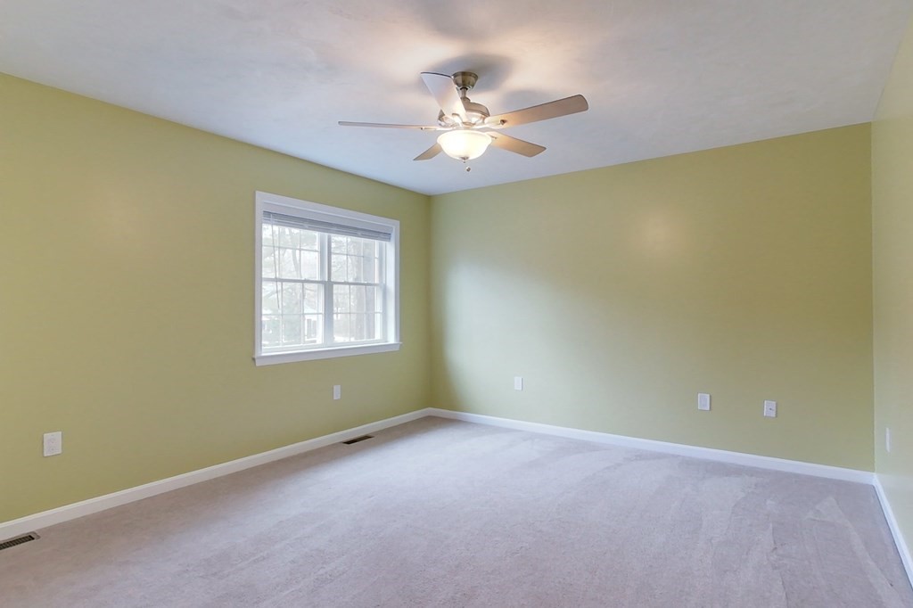 384 Richardson Road Ashby, MA 01431 - Photo 20 of 40 an empty room with a window and a fan