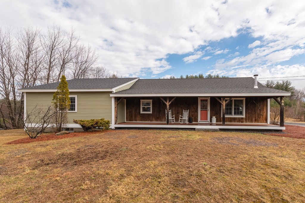 384 Richardson Road Ashby, MA 01431 - Photo 33 of 40 front view of a house with a yard