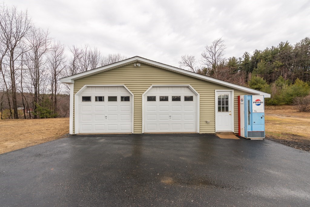 384 Richardson Road Ashby, MA 01431 - Photo 35 of 40 a view of a house with a backyard