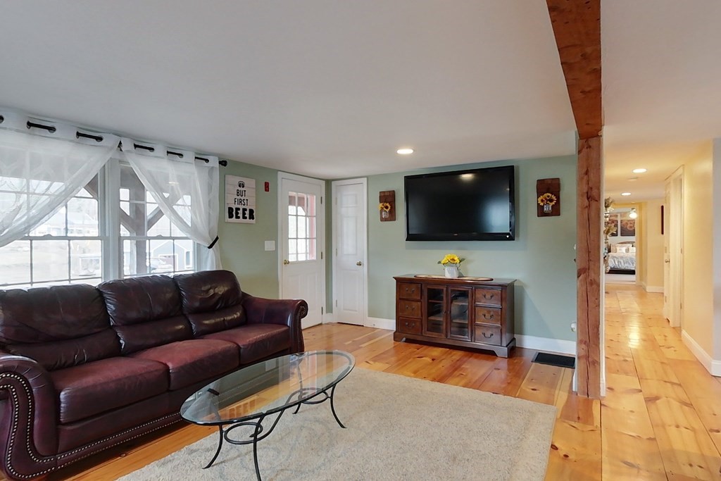 384 Richardson Road Ashby, MA 01431 - Photo 8 of 40 a living room with furniture and a flat screen tv