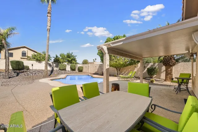 a view of a patio with swimming pool