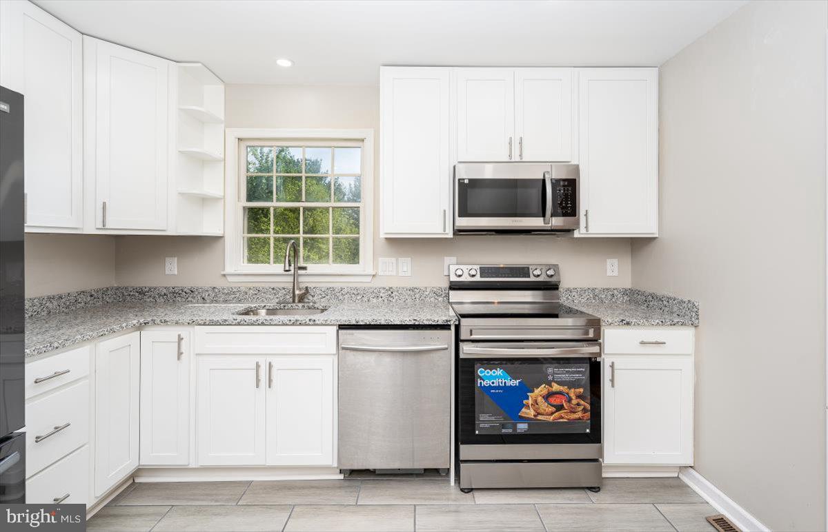 1013 Uniontown Road Westminster, MD 21158 - Photo 16 of 45 Stove with built in Air Fryer