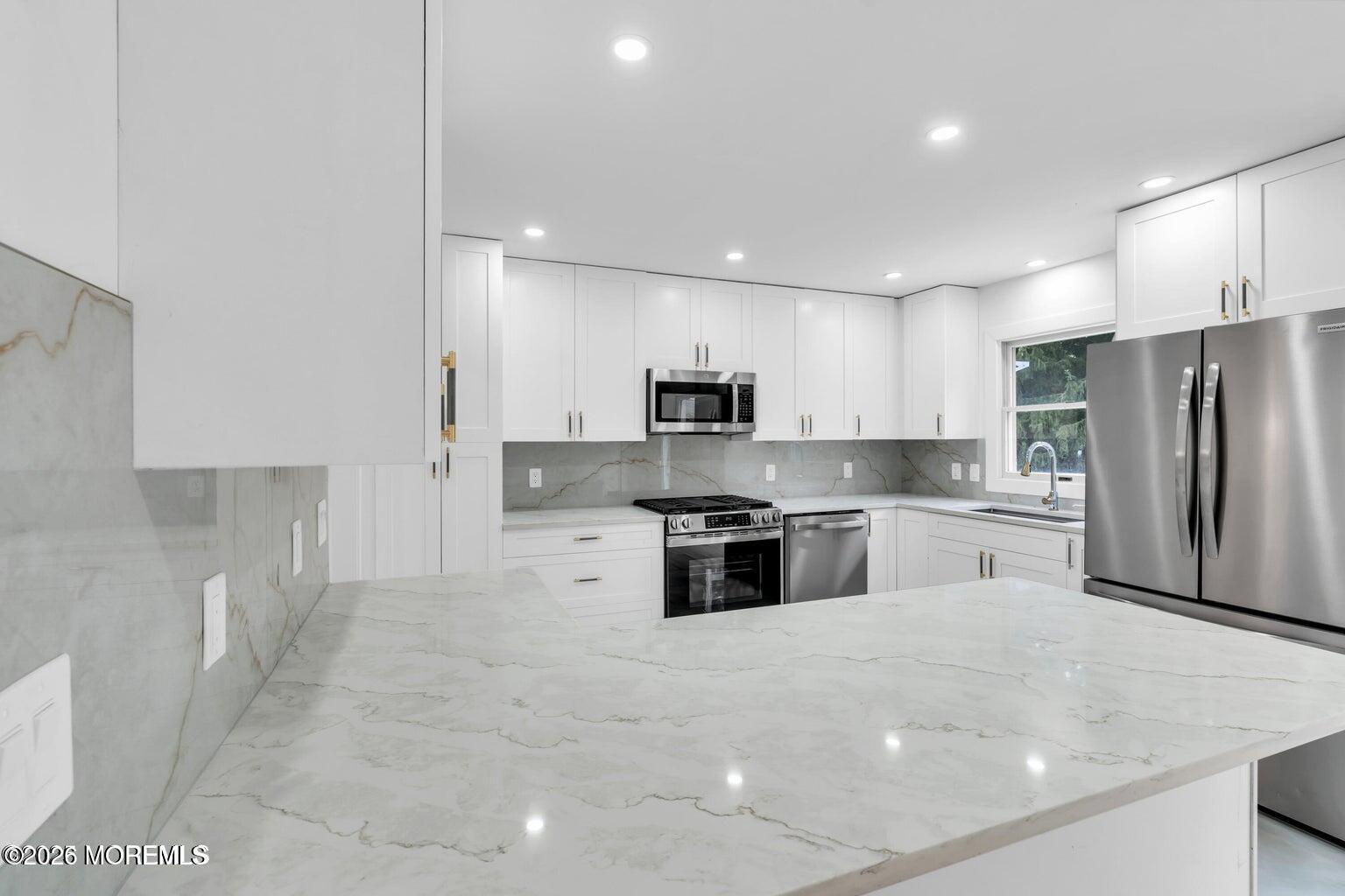 88 Hickory Hill Road Jackson, NJ 08527 - Photo 11 of 21 a kitchen with stainless steel appliances a refrigerator sink and microwave