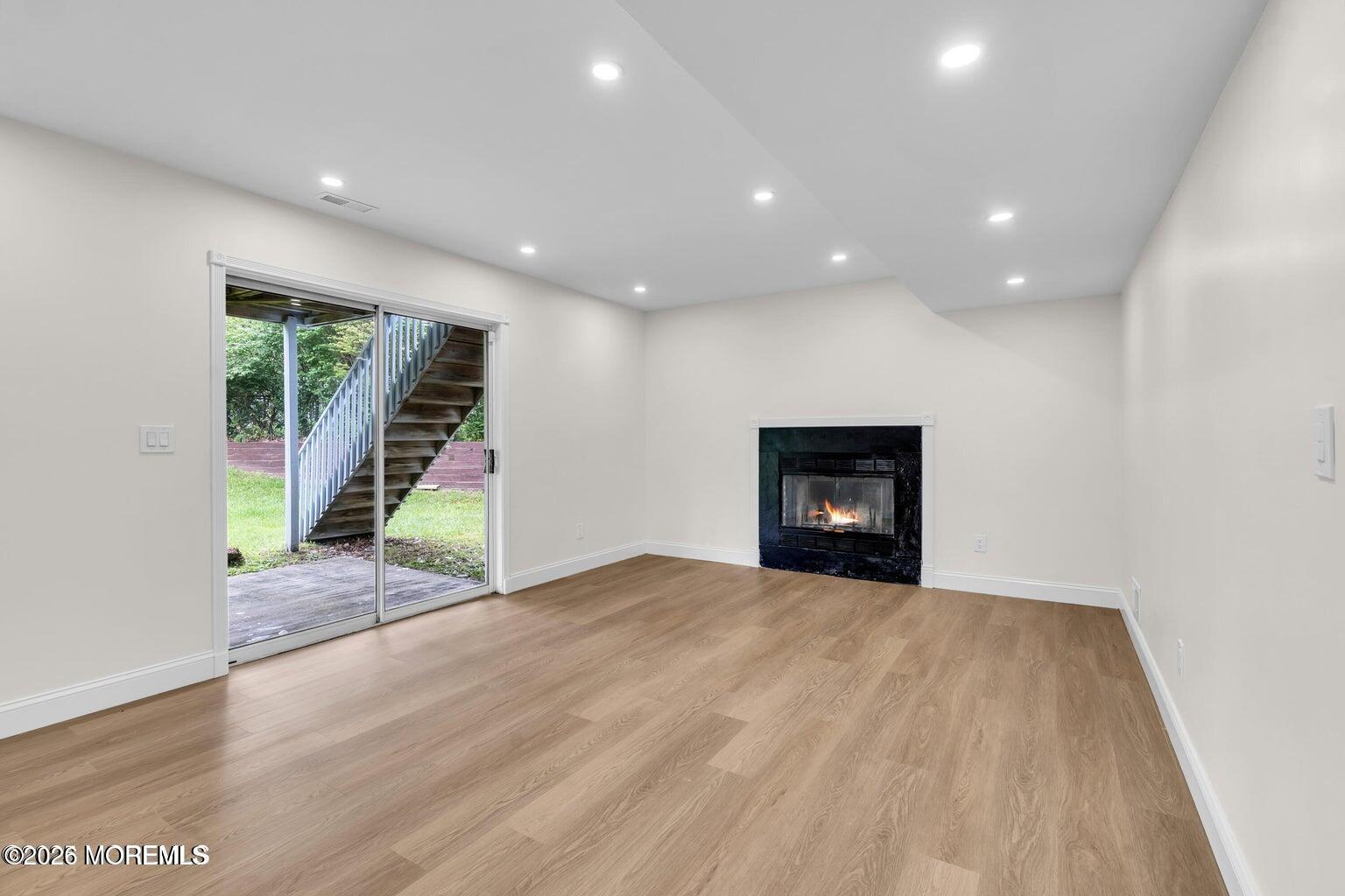 88 Hickory Hill Road Jackson, NJ 08527 - Photo 15 of 21 a view of an empty room with wooden floor and a window