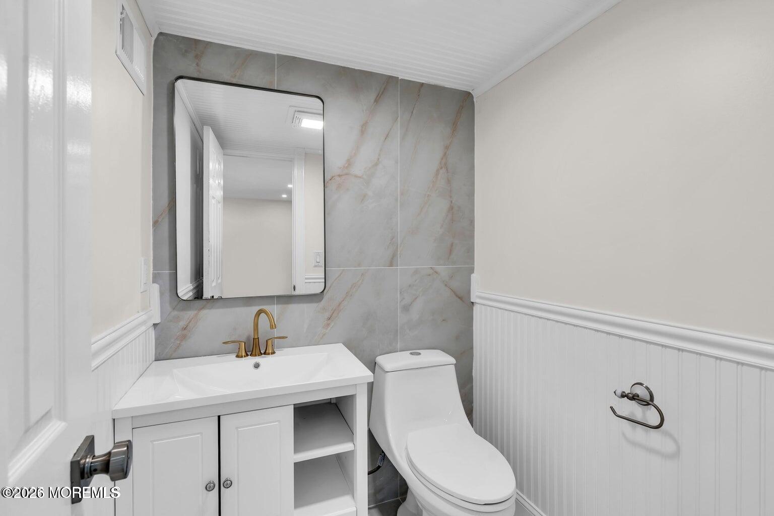 88 Hickory Hill Road Jackson, NJ 08527 - Photo 16 of 21 a bathroom with a sink a toilet and mirror