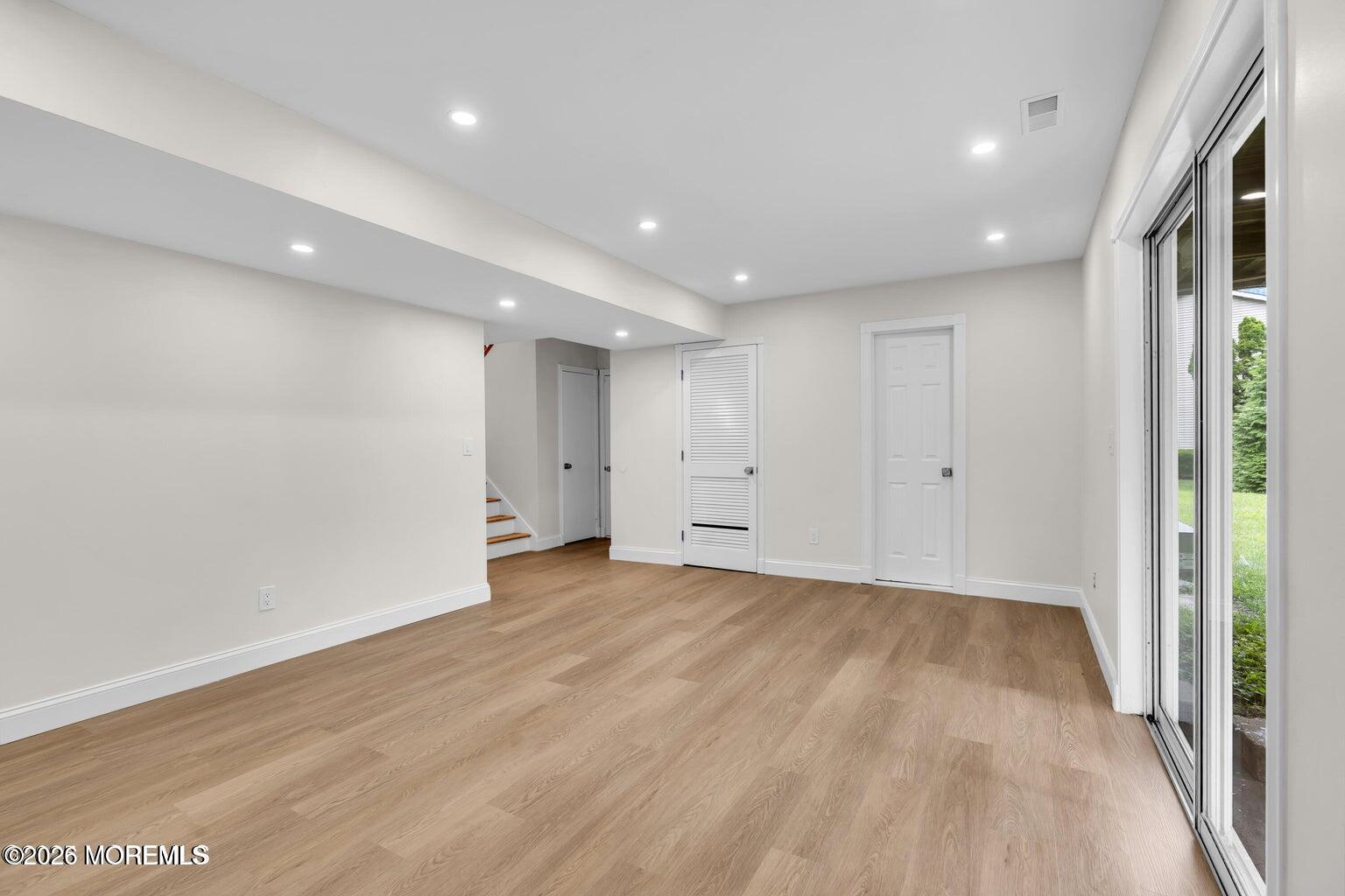 88 Hickory Hill Road Jackson, NJ 08527 - Photo 17 of 21 an empty room with wooden floor and windows