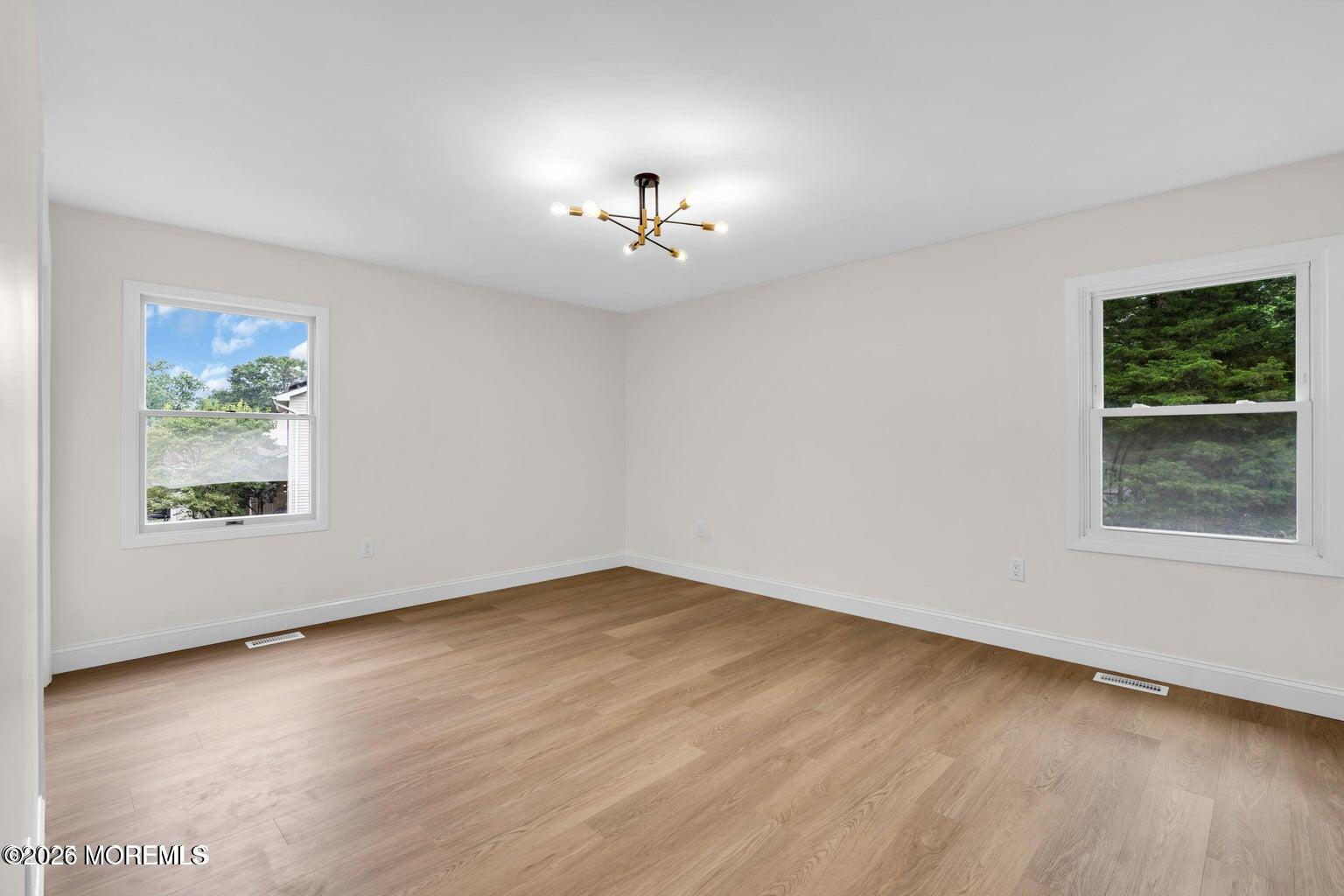 88 Hickory Hill Road Jackson, NJ 08527 - Photo 18 of 21 wooden floor in an empty room with a window