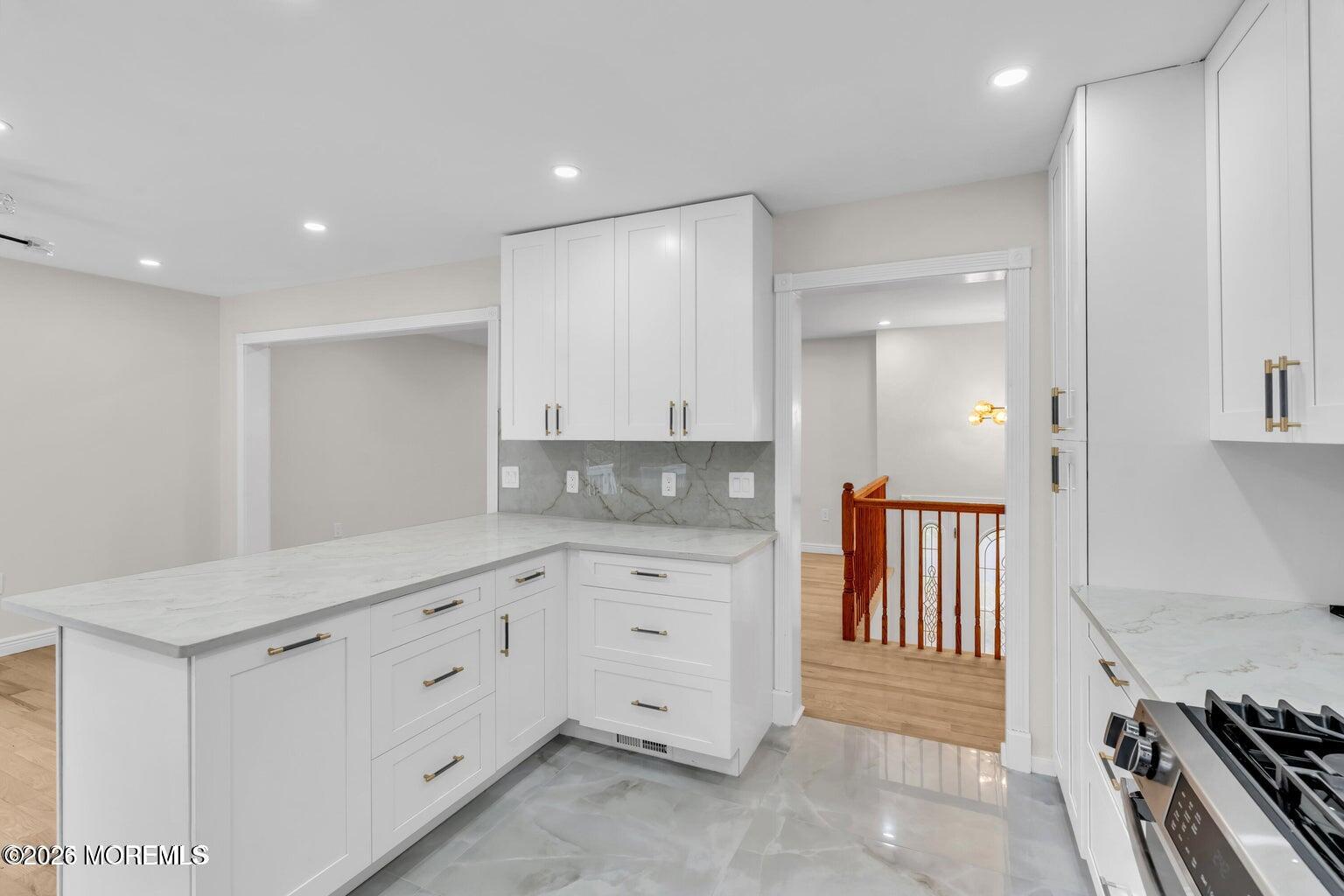 88 Hickory Hill Road Jackson, NJ 08527 - Photo 10 of 21 a kitchen with white cabinets appliances and a sink