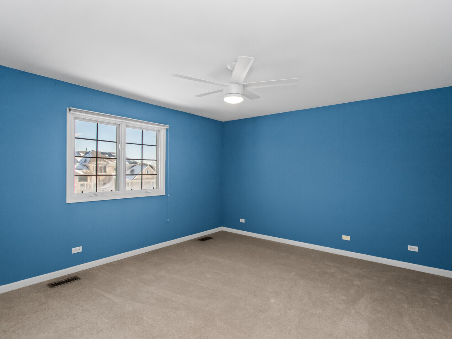 2008 Jordan Terrace Buffalo Grove, IL 60089 - Photo 19 of 33 an empty room with a window and a ceiling fan