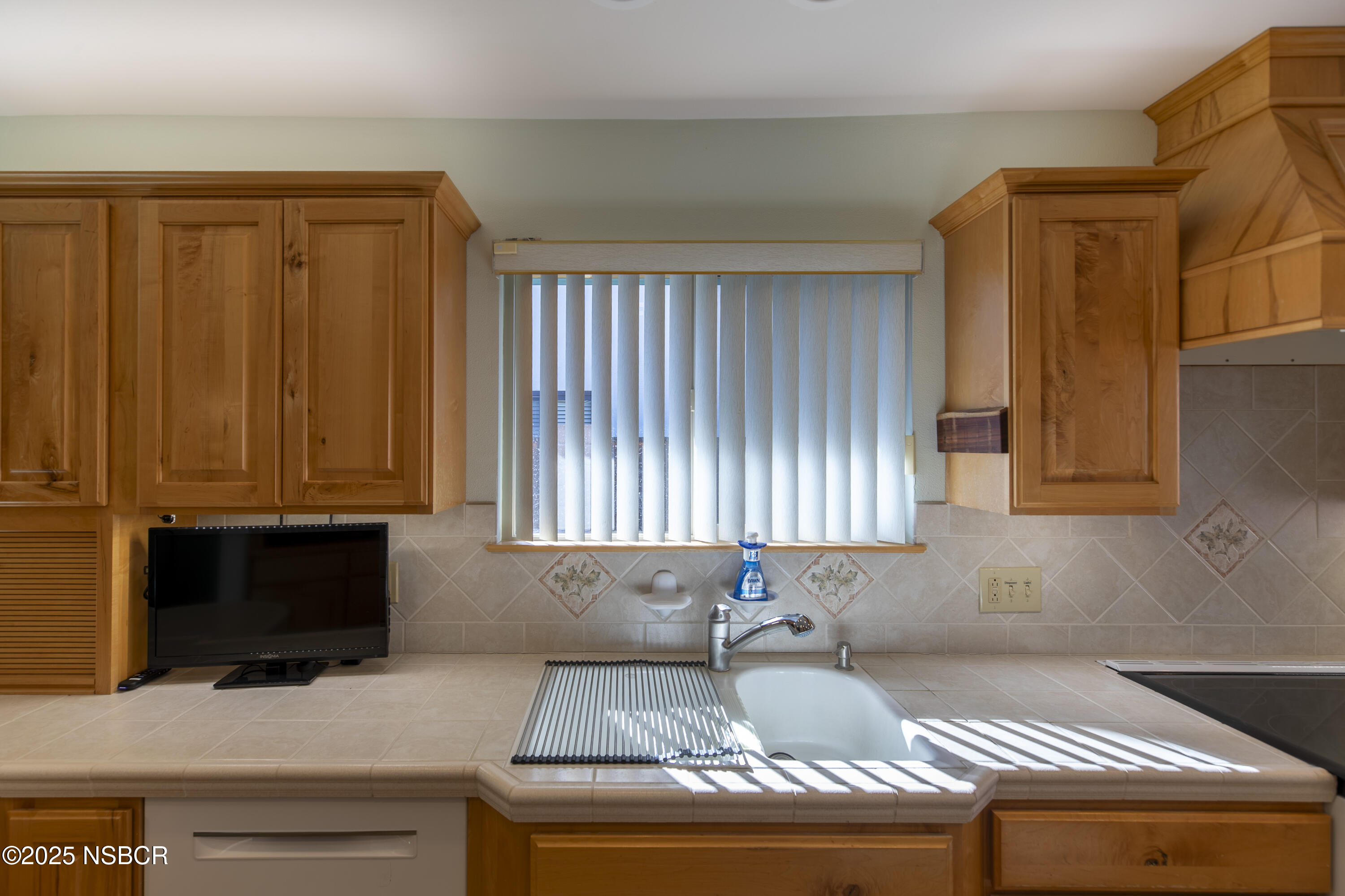 4490 Sirius Avenue Lompoc, CA 93436 - Photo 13 of 55 a kitchen with granite countertop cabinets and a sink