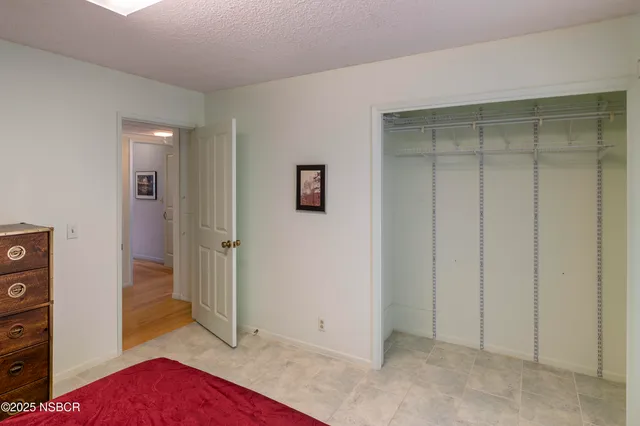 a bedroom with a bed and a closet