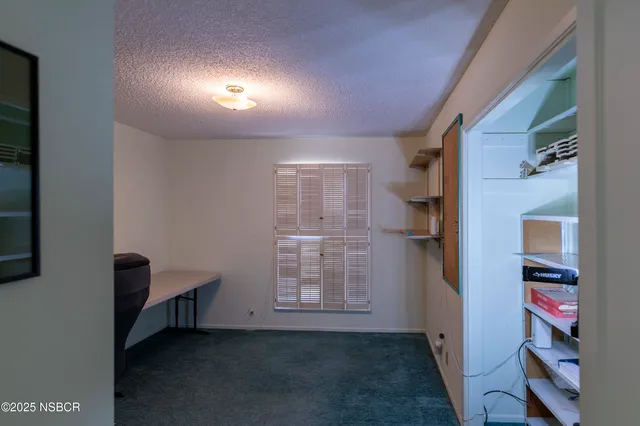 a view of a workspace with furniture