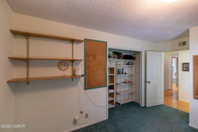 a view of gallery with windows