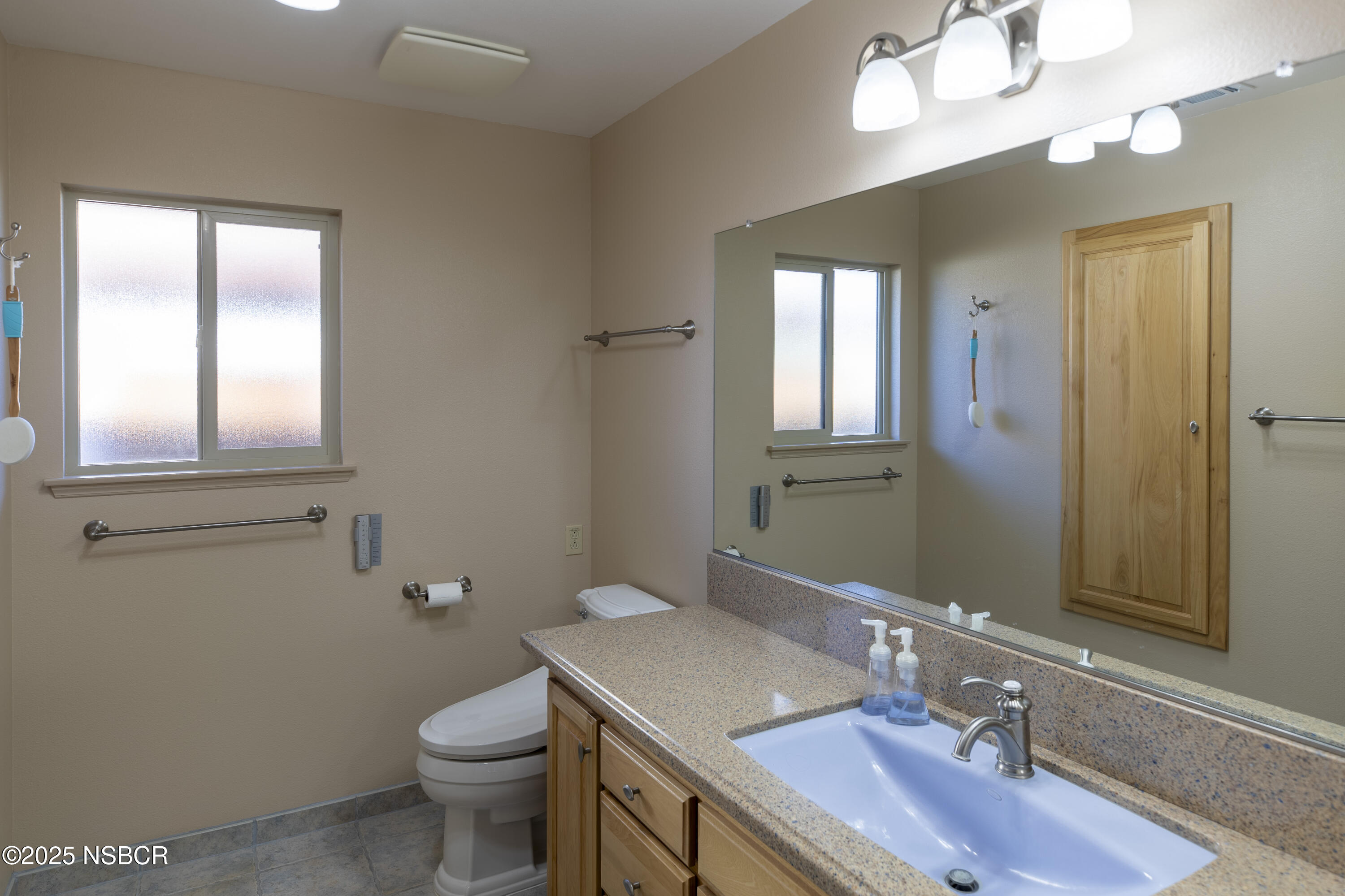 4490 Sirius Avenue Lompoc, CA 93436 - Photo 34 of 55 a bathroom with a sink a toilet and mirror