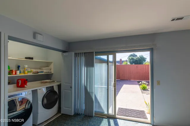 a backyard of a house with wooden fence