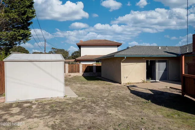 a view of a chairs and table in the patio