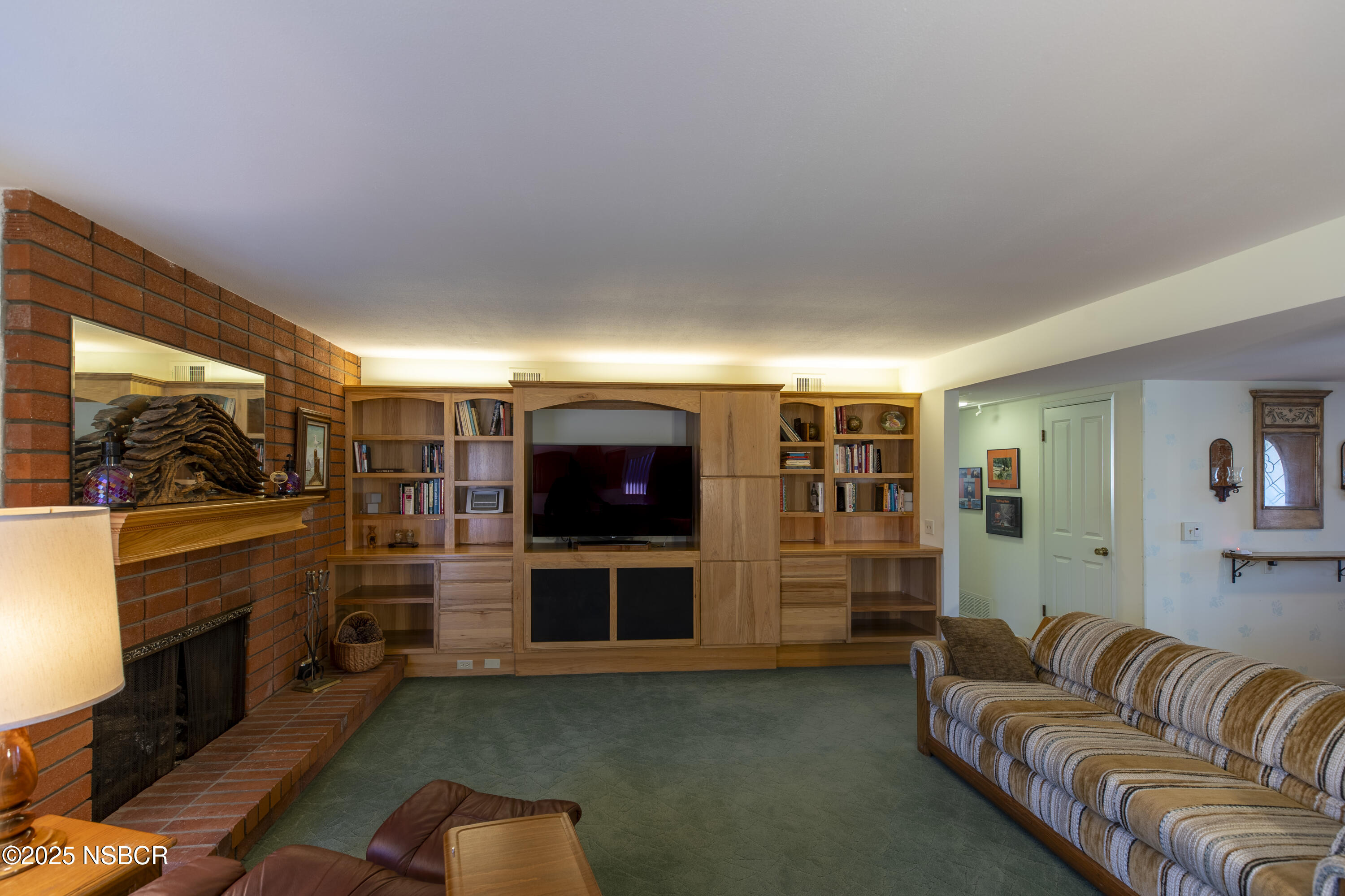 4490 Sirius Avenue Lompoc, CA 93436 - Photo 8 of 55 a living room with fireplace furniture and a flat screen tv