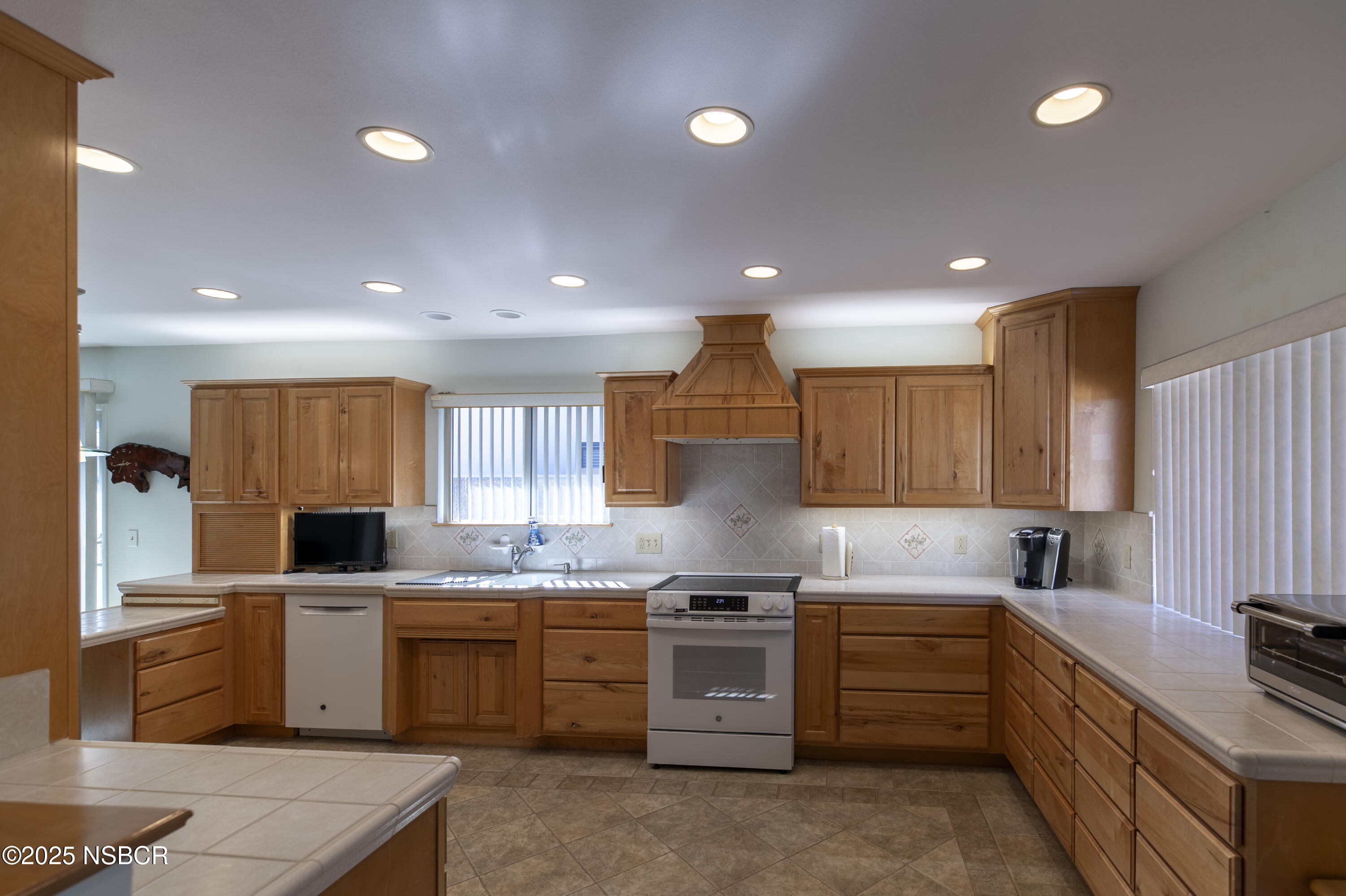 4490 Sirius Avenue Lompoc, CA 93436 - Photo 9 of 55 a kitchen with a sink stove top oven and cabinets