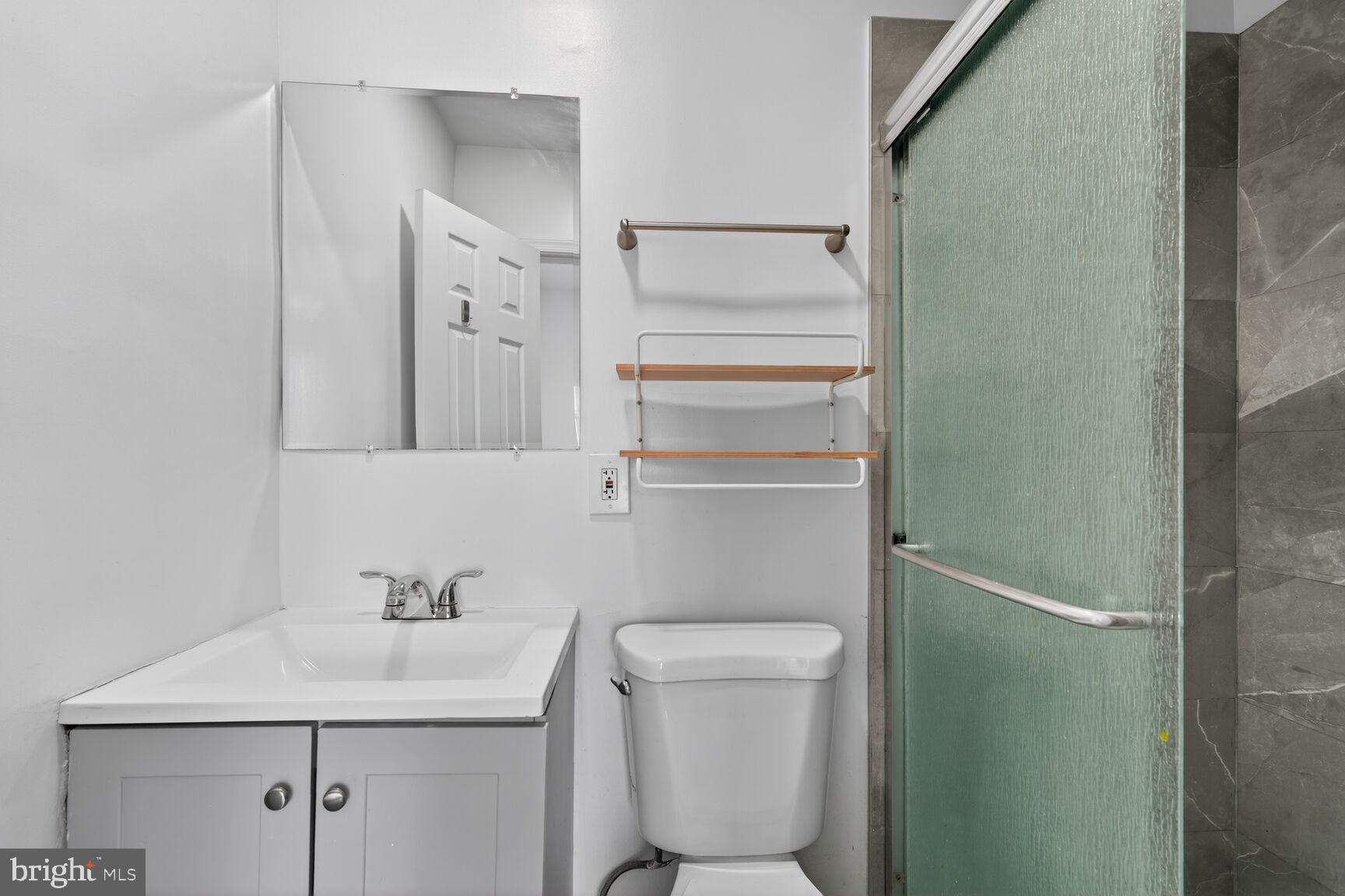 2409 18th Street Northwest, Unit 2 Washington, DC 20009 - Photo 17 of 19 a bathroom with a sink a toilet and shower