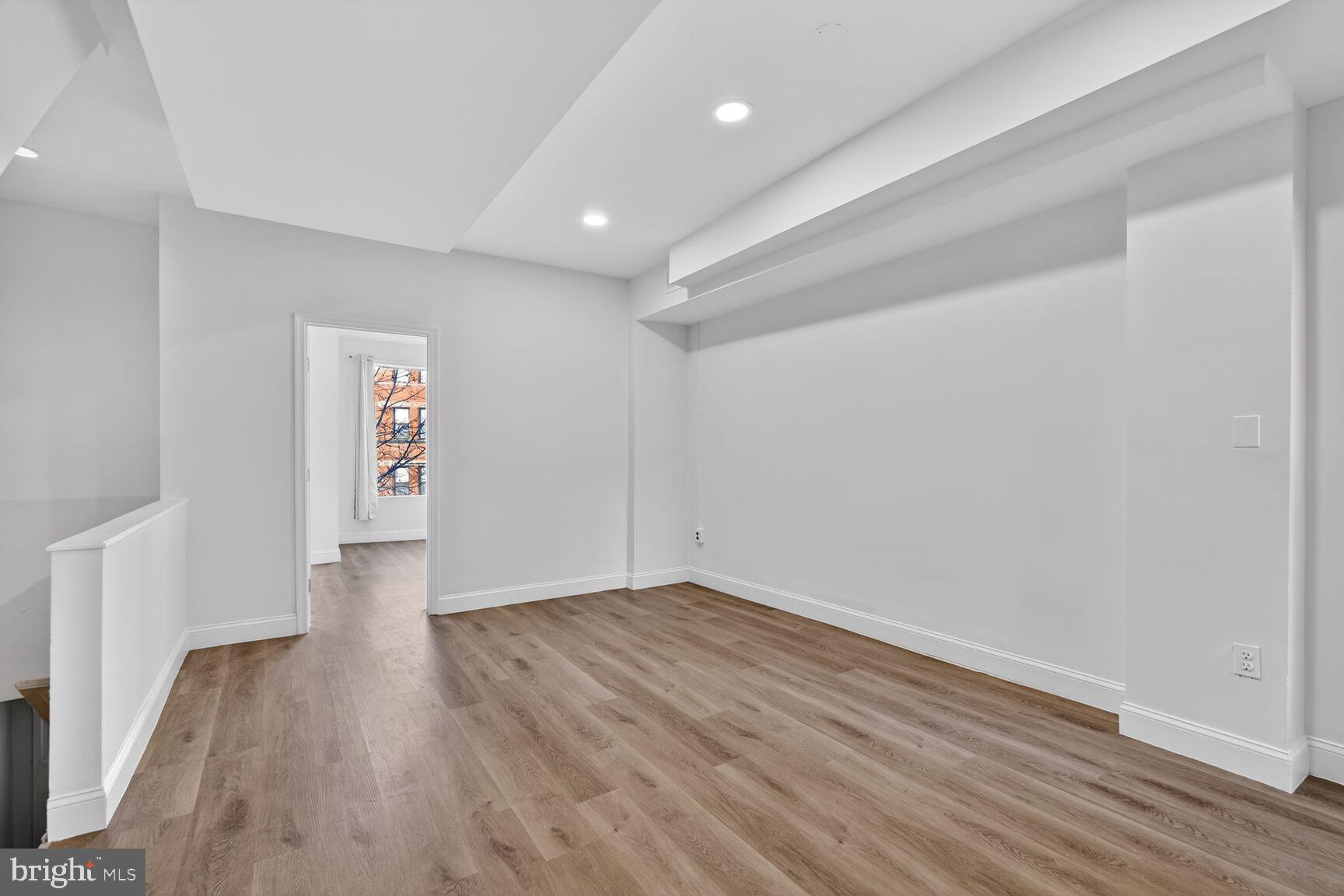 2409 18th Street Northwest, Unit 2 Washington, DC 20009 - Photo 3 of 19 a view of an empty room with wooden floor