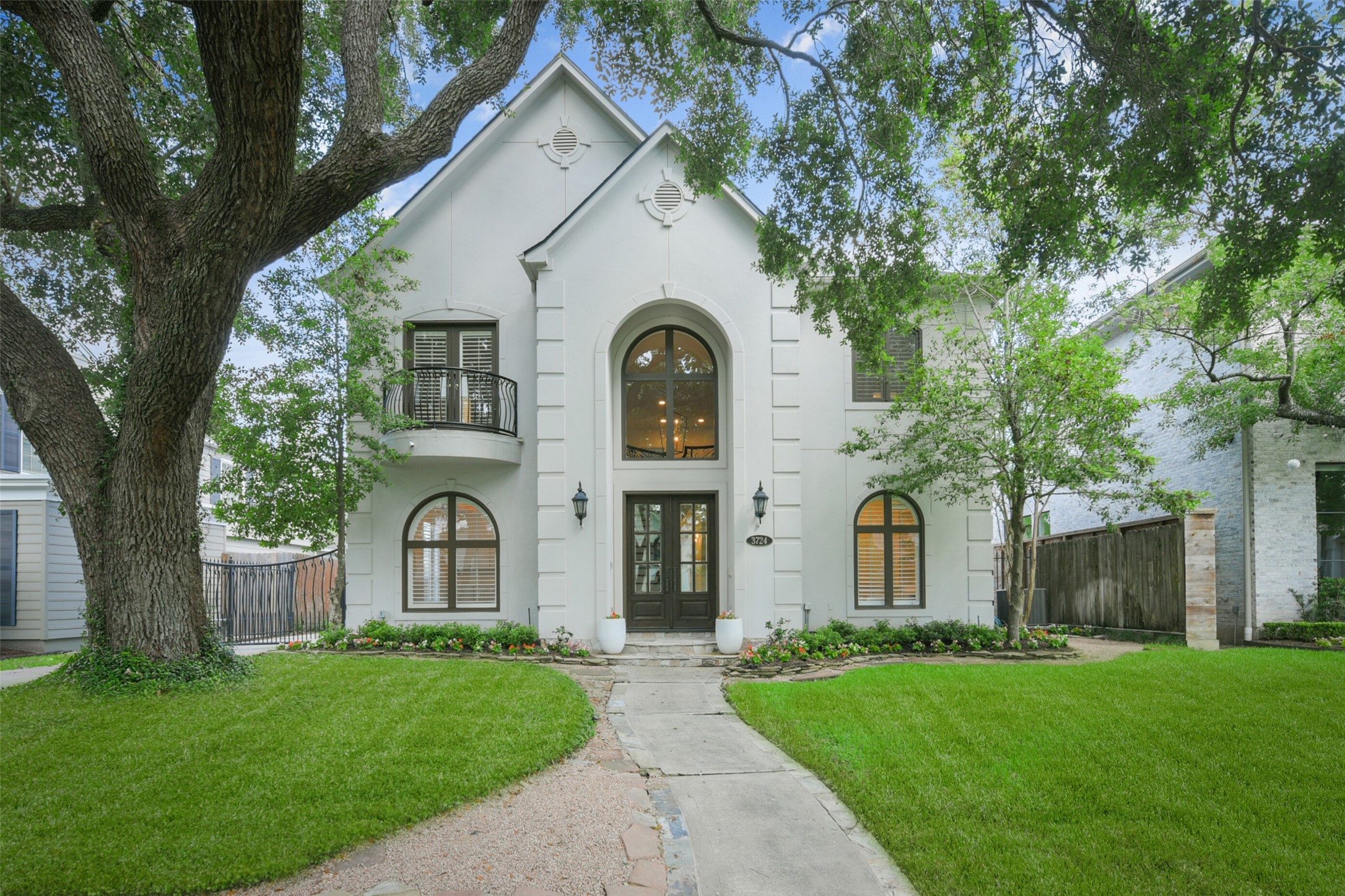 3724 Wroxton Road Houston, TX 77005 - Photo 1 of 40 3724 Wroxton has lovely curb appeal with stucco exterior, mature trees, and well-kept landscaping with sprinkler system.