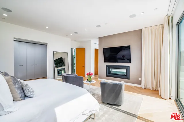 a bedroom with a bed and a television in it