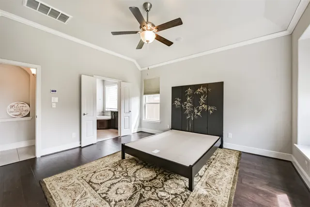 a living room with window and wooden floor