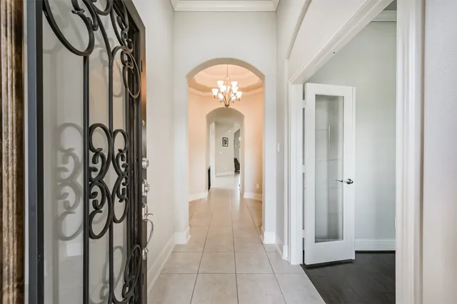 a view of a entryway door with a hallway