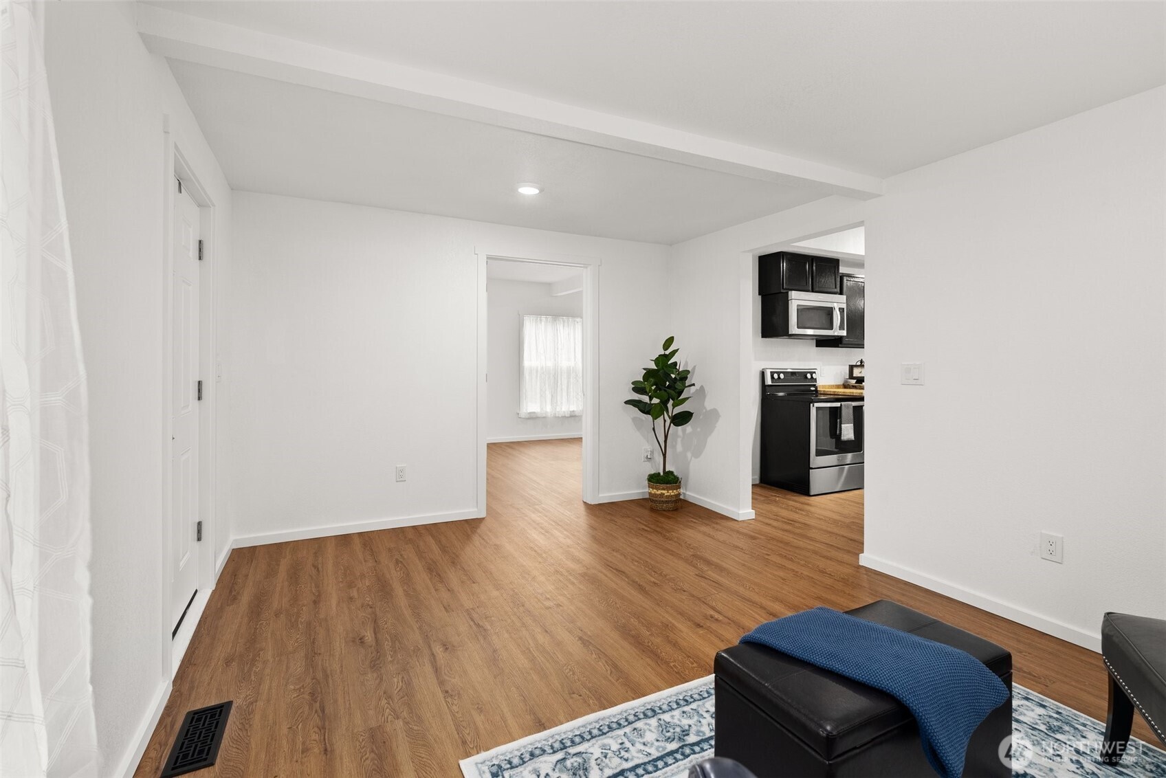 901 L Street Centralia, WA 98531 - Photo 7 of 28 a view of a livingroom with wooden floor and a couch