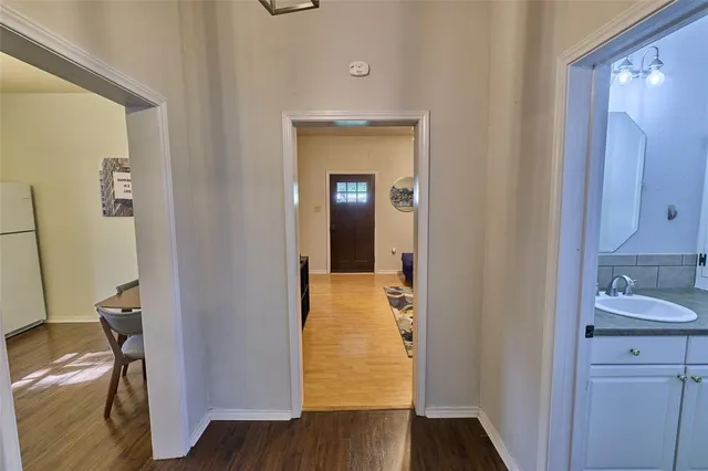 a bathroom with a sink a mirror and a shower